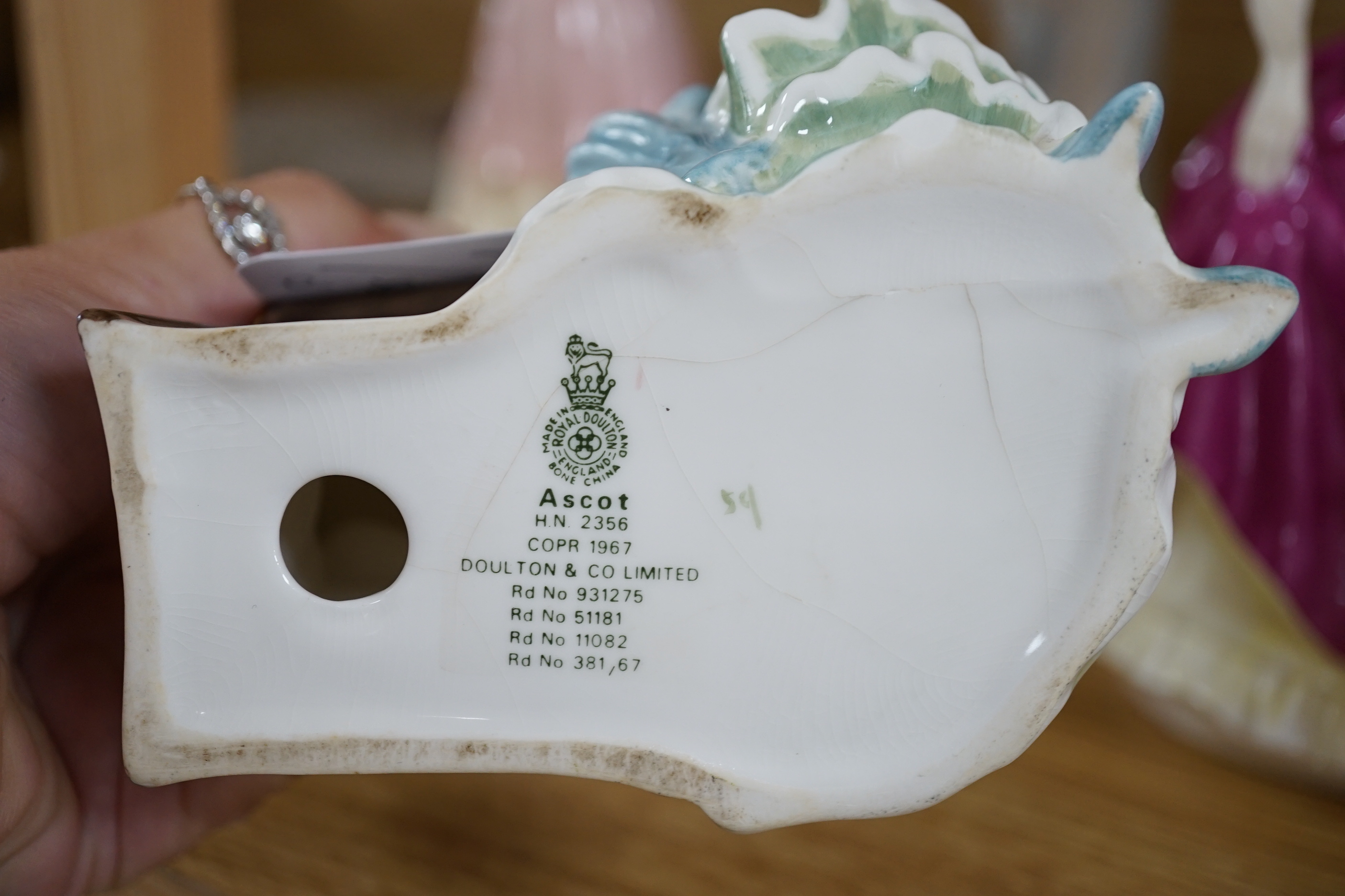 Seven Royal Doulton figurines and three Coalport figurines